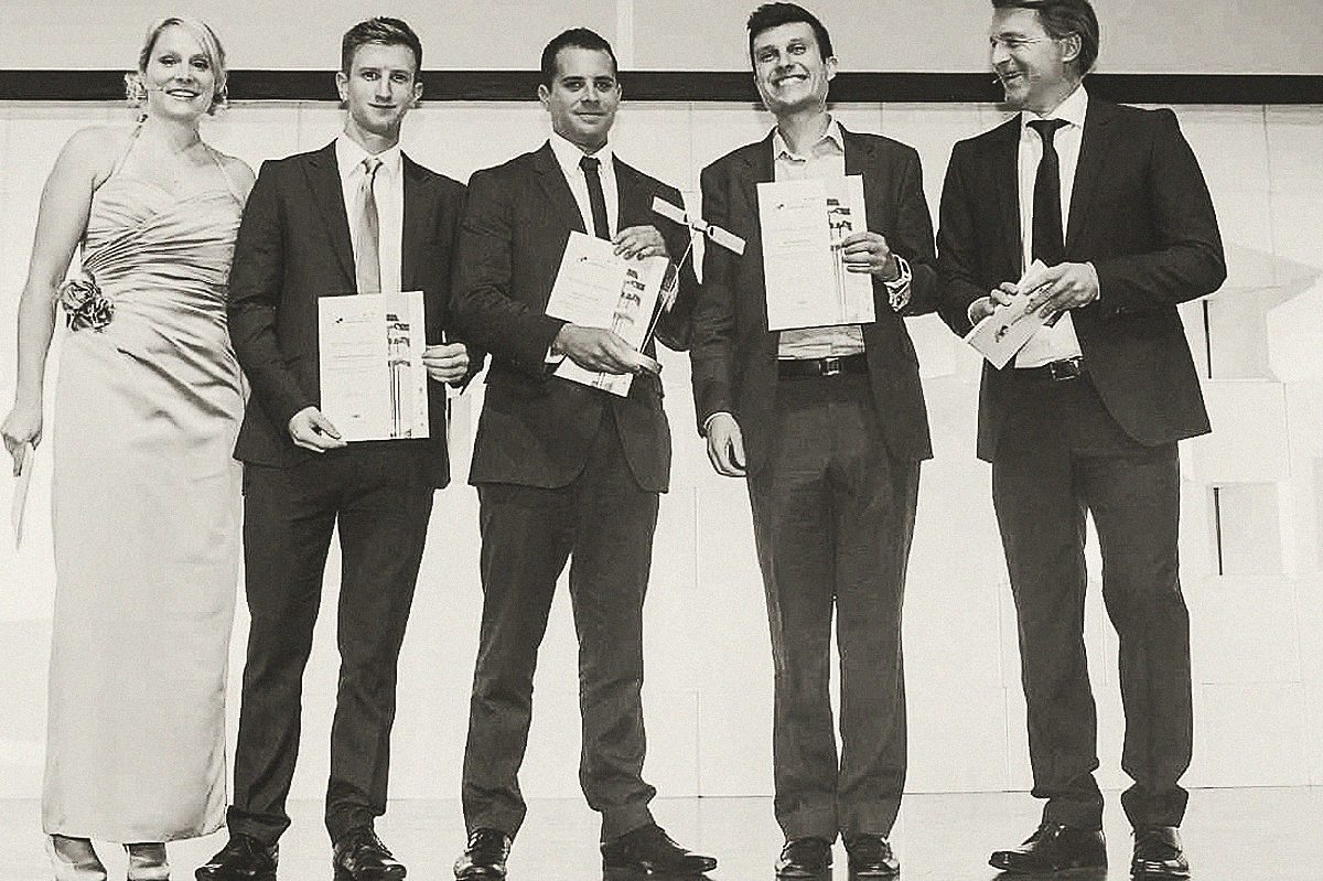 Alfie and team collecting the European Satellite Navigation Competition award on stage, 2013